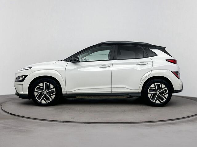 Hyundai Kona EV Fashion 64 kWh | SOH 96% | Dodehoek detectie | Navigatie | Achteruitrij camera | Stoelverwarming | Head up display |