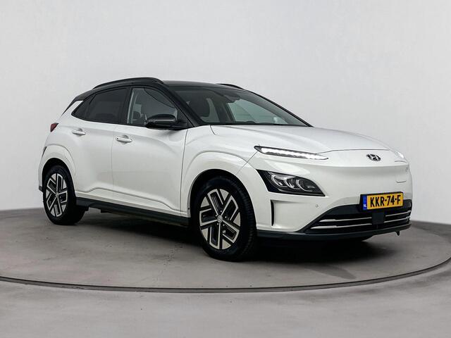 Hyundai Kona EV Fashion 64 kWh | SOH 96% | Dodehoek detectie | Navigatie | Achteruitrij camera | Stoelverwarming | Head up display |