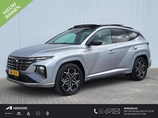 Hyundai TUCSON 1.6 T-GDI PHEV N Line Sky 4WD Automaat / Dealer onderhouden / Panorama Schuifdak / 1.350 kg Trekgewicht / Stoelventilatie / Stuur-, stoel- en achterbankverwarming / Navigatie / Apple Carplay Android / 19" LM wielen / All Season banden /