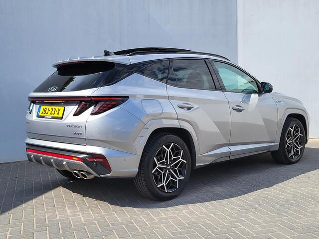 Hyundai TUCSON 1.6 T-GDI PHEV N Line Sky 4WD Automaat / Dealer onderhouden / Panorama Schuifdak / 1.350 kg Trekgewicht / Stoelventilatie / Stuur-, stoel- en achterbankverwarming / Navigatie / Apple Carplay Android / 19" LM wielen / All Season banden /