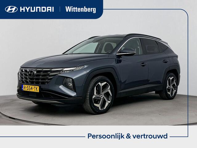 Hyundai TUCSON 1.6 T-GDI HEV Premium | All season banden | Parkeersensoren | Lederenbekleding | Metallic lak |