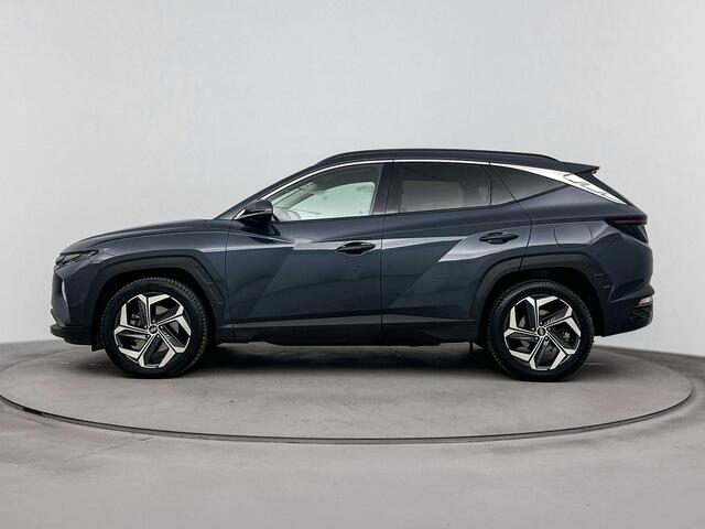 Hyundai TUCSON 1.6 T-GDI HEV Premium | All season banden | Parkeersensoren | Lederenbekleding | Metallic lak |