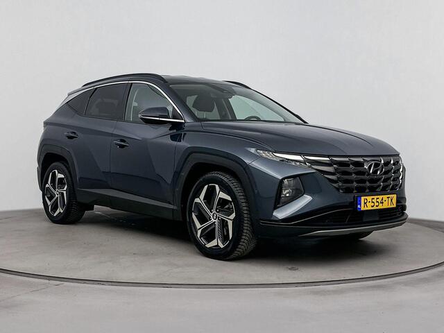 Hyundai TUCSON 1.6 T-GDI HEV Premium | All season banden | Parkeersensoren | Lederenbekleding | Metallic lak |