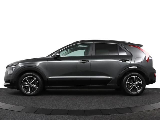 KIA Niro 1.6 GDi Hybrid DynamicPlusLine Airco - Apple Carplay/Android Auto - Cruise Control - Dodehoekdetectie - Navigatie - Schuif/Kanteldak - - Fabrieksgarantie tot 04-2032
