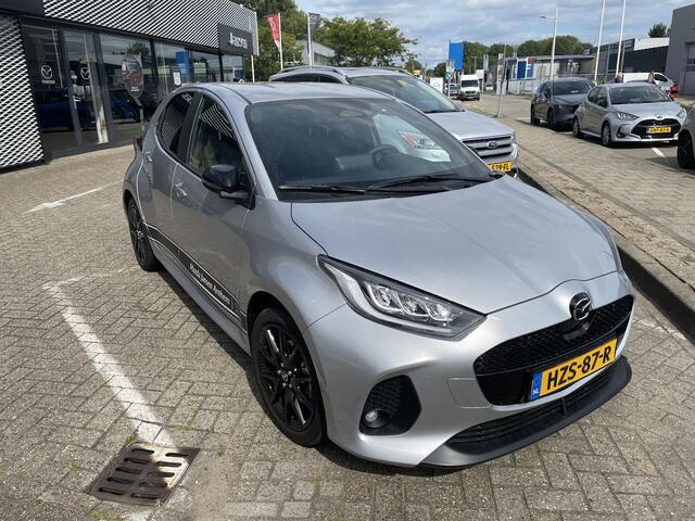 Mazda 2 Hybrid 1.5 Homura , Demovoordeel ¤ 3.000,-, Automaat, Apple Carplay, Clima, Adap.Cruise, LMV 17 Inch, Camera, PDC, Stuur/Stoelverwarming
