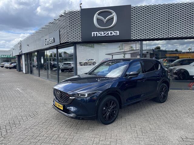 Mazda CX-5 2.0 e-SkyActiv-G M Hybrid 165 Homura , Automaat, Trekhaak, Leder, Adap. Cruise, LKA, Bose, HUD, LMV 19 Inch, 360 Camera, Navi, Apple Carplay, Stoelverwarming, Stuurverwarming, Stoelverkoeling, PDC, Elektrische klep