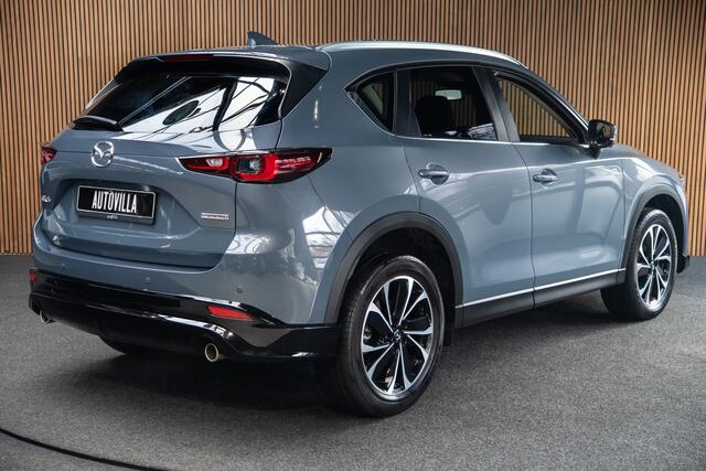 Mazda CX-5 2.0 e-SkyActiv-G M Hybrid 165 HUD Navi 360 ° PDC Stuur- & stoelverwarming Elektr. bedienbare achterklep Climate C. Cruise C. LM velgen Splinternieuw!