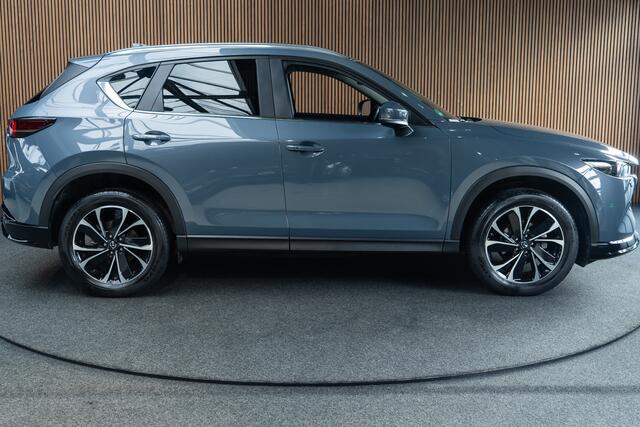 Mazda CX-5 2.0 e-SkyActiv-G M Hybrid 165 HUD Navi 360 ° PDC Stuur- & stoelverwarming Elektr. bedienbare achterklep Climate C. Cruise C. LM velgen Splinternieuw!