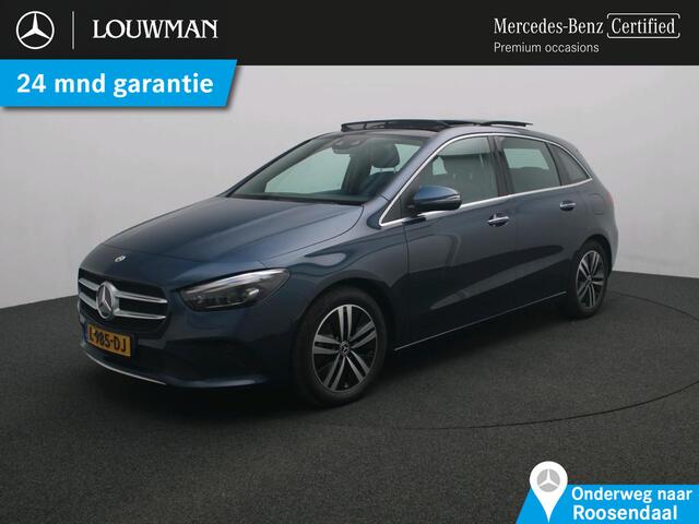 Mercedes-Benz B-KLASSE 180 Business Solution Luxury Trekhaak | Panorama Schuif-Kanteldak | Memory voorstoelen | MBUX augmented reality voor navigatie | Sfeerverlichting. Inclusief 24 maanden Mercedes-Benz Certified garantie voor Europa.