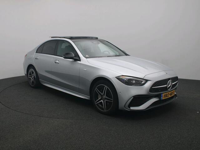 Mercedes-Benz C-KLASSE 300 e Business Solution AMG AMG Line | Panorama Schuif-Kanteldak | Distronic | Lederen bekleding | Alarm | Parkeerpakket met 360°-camera | 20 Inch AMG Velgen. Inclusief 24 maanden MB Certified garantie voor Europa.