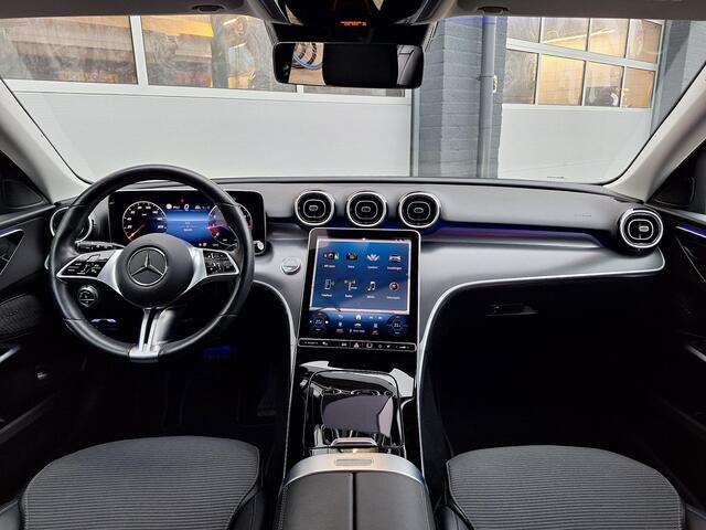 Mercedes-Benz C-KLASSE Estate 200 Luxury Line | Trekhaak | Rijassistentiepakket | Achteruitrijcamera | Sfeerverlichting | Stoelverwarming | Dodehoekassistentie | Elektrische achterklep