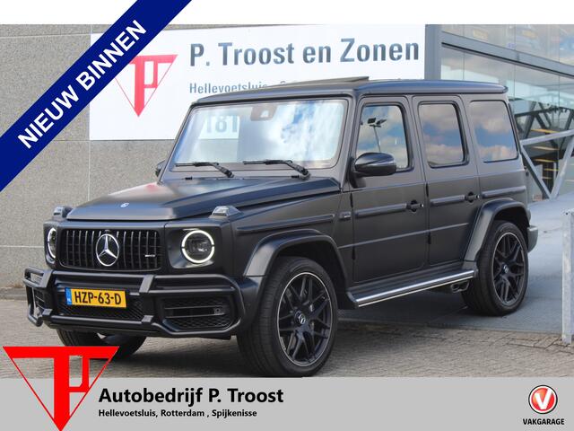 Mercedes-Benz G-KLASSE 63 AMG Manufaktur/Night pakket/Magno matt/Panoramadak/Burmester/Sfeerverlichting/Entertainment schermen/Akrapovic/AMG active ride control/Elektrisch verstelbare stoelen met memory + massage/Stoel verwarming + koeling/360° camera/voorruitverwarming/IWC/Ala