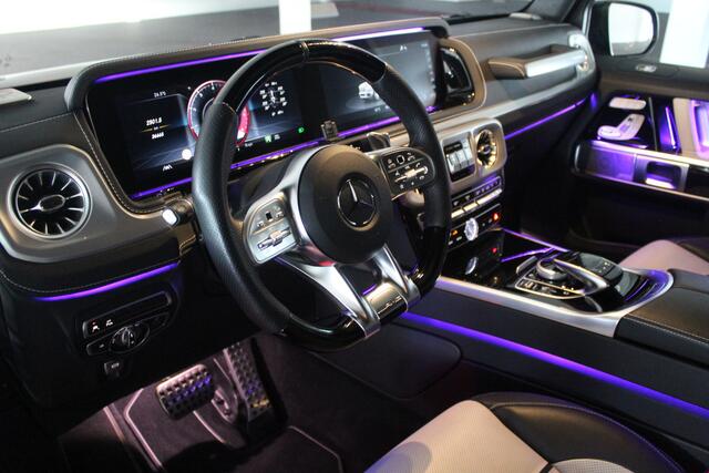 Mercedes-Benz G-KLASSE 63 AMG Manufaktur/Night pakket/Magno matt/Panoramadak/Burmester/Sfeerverlichting/Entertainment schermen/Akrapovic/AMG active ride control/Elektrisch verstelbare stoelen met memory + massage/Stoel verwarming + koeling/360° camera/voorruitverwarming/IWC/Ala