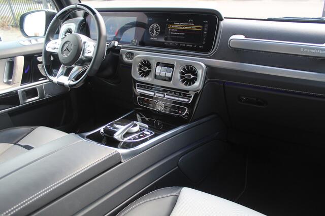 Mercedes-Benz G-KLASSE 63 AMG Manufaktur/Night pakket/Magno matt/Panoramadak/Burmester/Sfeerverlichting/Entertainment schermen/Akrapovic/AMG active ride control/Elektrisch verstelbare stoelen met memory + massage/Stoel verwarming + koeling/360° camera/voorruitverwarming/IWC/Ala