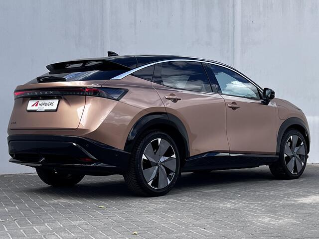 Nissan Ariya Evolve 87 kWh Automaat / WLTP bereik 516 km / Trekgewicht 750 kg / CCS snelladen / Stoelventilatie / Stuur-, stoel- en achterbankverwarming / Voorruitverwarming / HUD / Camera 360° /