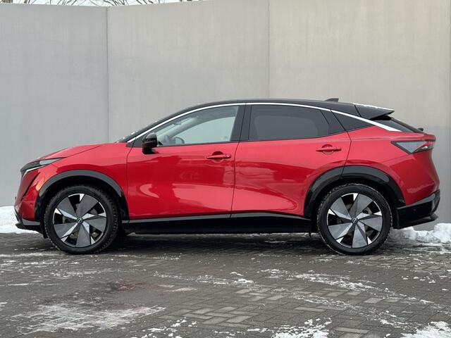 Nissan Ariya Evolve 91 kWh / Warmtepomp / Stuur- & Stoelverwarming / Voorruitverwarming / Geventileerde Voorstoelen / Binnenspiegel Camera / Schuif & Kanteldak / Head-Up Display / Bose Premium Audio / Adaptieve Cruise Control / Apple Carplay & Android Auto /