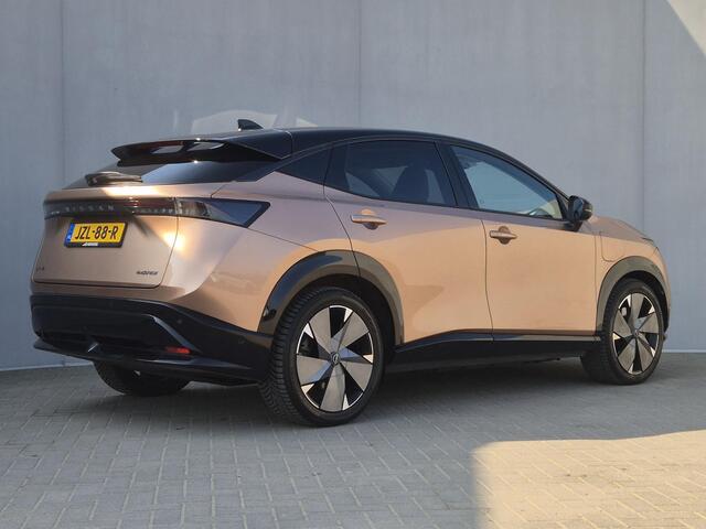 Nissan Ariya e-4ORCE Evolve+ Pack 87 kWh Automaat / Accu SOH 99% / Fabrieksgarantie tot 07-2027 / CCS snelladen / WLTP bereik 498 km bereik stad 612 km / Head Up Display / Glazen schuif- en kanteldak / Stuur-, Stoel & Achterbank verwarming / Elektrische achterklep / S