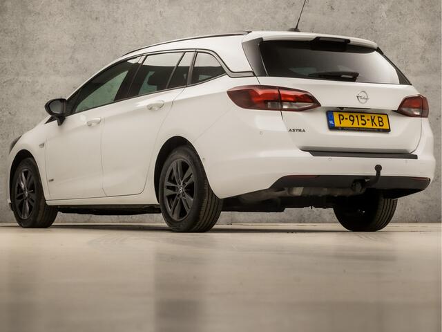 Opel ASTRA Sports Tourer 1.2 Sport (APPLE CARPLAY, NAVIGATIE, ADAPTIVE CRUISE, CLIMATE, CAMERA, TREKHAAK, LEDER, SPORTSTOELEN, PARKEERSENSOREN, LED KOPLAMPEN, DAB+, NIEUWSTAAT)