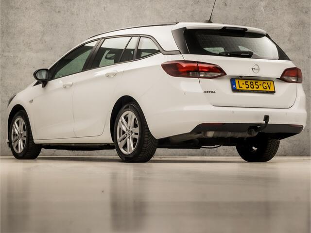 Opel ASTRA Sports Tourer 1.2 Sport (APPLE CARPLAY, NAVIGATIE, CRUISE, CAMERA, SPORTSTOELEN, PARKEERSENSOREN, TREKHAAK, LM VELGEN, LED KOPLAMPEN, NIEUWSTAAT)