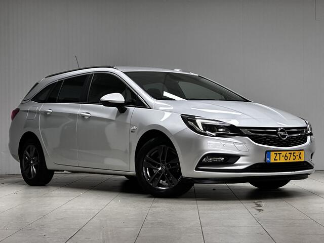 Opel ASTRA Sports Tourer 1.0 Turbo 120 Jaar Edition /Apple + Android /DAB+! /Navi /Climat /Cruise /Elek. pakket /Bluetooth /Regensensor /16"LMV /Extra getint glas /PDC V+A /LED Dagrijverl. /Dakrails.