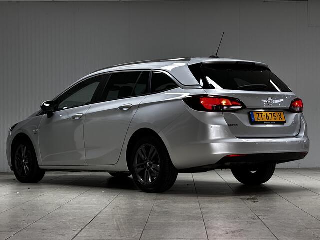 Opel ASTRA Sports Tourer 1.0 Turbo 120 Jaar Edition /Apple + Android /DAB+! /Navi /Climat /Cruise /Elek. pakket /Bluetooth /Regensensor /16"LMV /Extra getint glas /PDC V+A /LED Dagrijverl. /Dakrails.