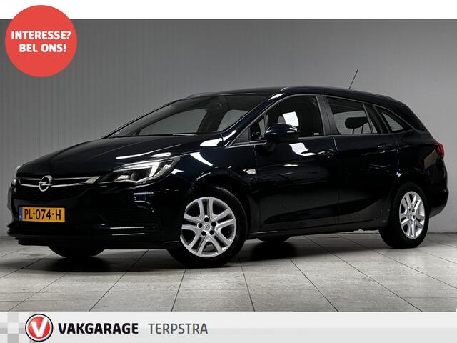 Opel ASTRA Sports Tourer 1.0 Online Edition/ Trekhaak/ Apple + Android/ DAB+/ Navi/ Airco/ Cruise/ Elek. pakket/ Isofix/ Bluetooth/ Armsteun/ Multi. LEDER. Stuur/ PDC V+a/ Dakrails/ LED Dagrijverl.