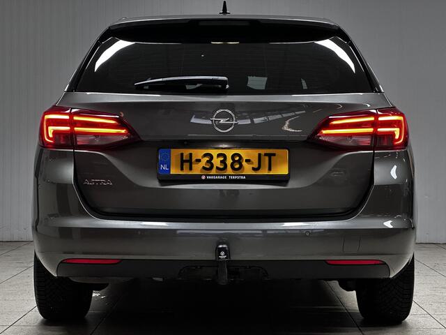 Opel ASTRA Sports Tourer 1.2 Elegance/ Trekhaak!/ LED Koplampen/ Virtual Cockpit/ Dodehoekdetectie/ Camera/ Zwarte Hemel/ Grootlichtass./ Keyless/ DAB+/ Apple+Android/ Clima/ Navi/ Cruise/ Bluetooth/ Multi.LEDER.Stuur/ Elek.Pakket