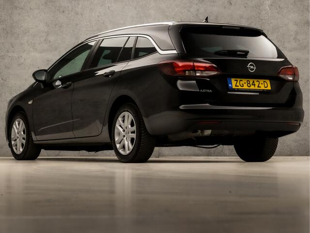 Opel ASTRA Sports Tourer 1.0 Turbo Sport (APPLE CARPLAY, GROOT NAVI, CLIMATE, SPORTSTOELEN, LEDER, PARKEERSENSOREN, GETINT GLAS, LM VELGEN, NIEUWSTAAT)