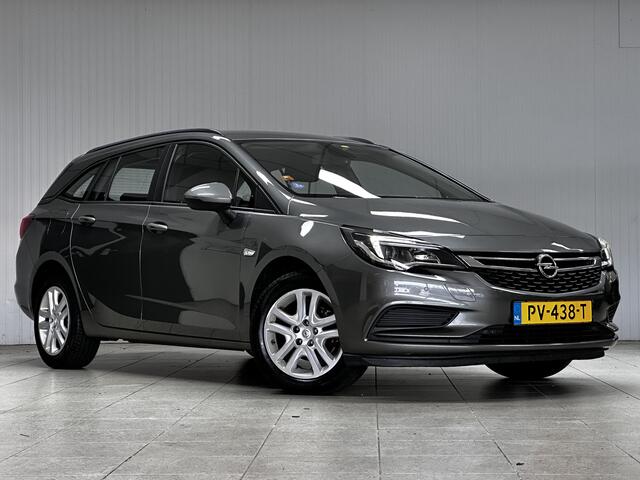 Opel ASTRA Sports Tourer 1.0 Online Edition/ PDC V+A/ Apple + Android/ DAB+/ Navi/ Airco/ Cruise/ Elek. pakket/ Isofix/ Bluetooth/ Armsteun/ Multi. LEDER. Stuur/ LED Dagrijverl.