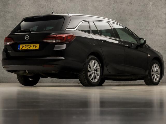 Opel ASTRA Sports Tourer 1.2 Elegance Sport (APPLE CARPLAY, GROOT NAVI, MATRIX LED KOPLAMPEN, KEYLESS, CAMERA, ADAPTIVE CRUISE, GETINT GLAS, LM VELGEN, NIEUWSTAAT)