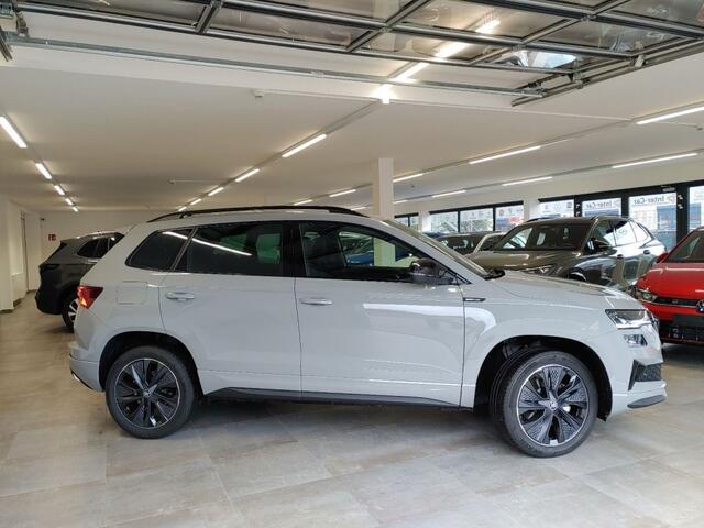 Skoda Karoq 1.5 TSI DSG SPORTLINE TREKHAAK/CAMERA/CARPLAY/ACC/STOELVERW/E-KLEP