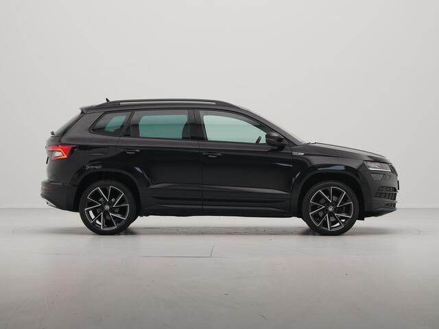 Skoda Karoq 1.5 TSI ACT 150pk Sportline Navigatie Trekhaak Camera Keyless Stoelverwarming 37 voorruit word vervangen
