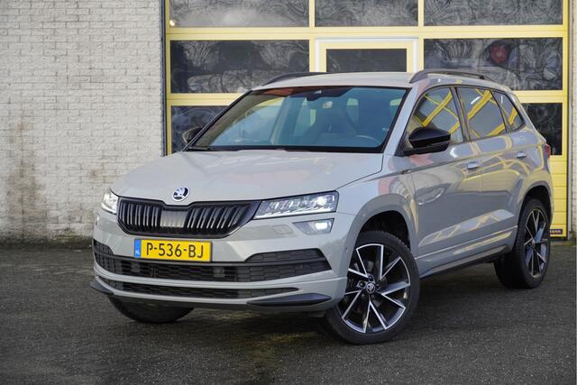 Skoda Karoq 1.5 TSI ACT 150PK! Automaat Sportline Business BJ2022 Lmv 19" | Led V+A | Pdc | Navi | Keyless entry | Elek. trekhaak | Verwarmd voorruit | Achteruitrijcamera | App-Connect | Virtual cockpit | Canton Audio | Verwarmde voorstoelen/stuurwiel | Zwarte hemel
