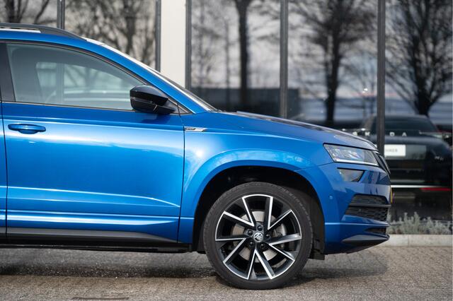 Skoda Karoq 1.5 TSI ACT Sportline Business | Trekhaak | Adapt. Cruise | CANTON | Camera | 19" | Winterpakket