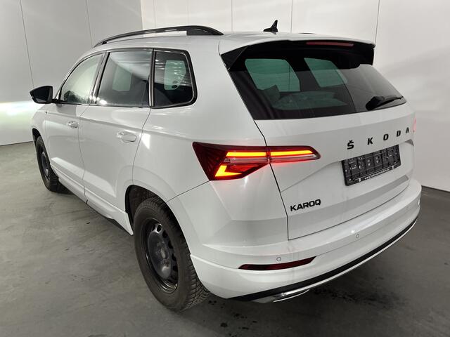 Skoda Karoq 1.5 TSI ACT Sportline / TREKHAAK/ STUUR+STOELVERWARM.V+A/ PARK.SENSOR.V+A/ CAMERA/ DCC/ SMARTLINK/ ACC/ KEYLESS/ NAVI/ RIJ-MODI/ CLIMA/ DAB/ LED/ DIGITAL DASH/ ISOFIX/ 18'' LMV