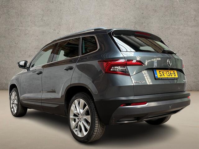 Skoda Karoq 1.0 TSI Sport Automaat (PANORAMADAK, APPLE CARPLAY, GROOT NAVI, CLIMATE, CAMERA, STOELVERWARMING, SPORTSTOELEN, GETINT GLAS, ADAPTIVE CRUISE, NIEUWE APK, NIEUWSTAAT)