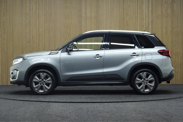 Suzuki VITARA 1.4 Boosterjet Style Smart Hybrid | Adaptive-cruise | Afneembare Trekhaak | Camera | Clima | Navigatie | Parkeersensoren | Stoelverwarming | Keyless | Dodehoekdetectie