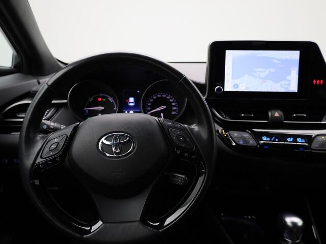 Toyota C-HR 1.8 Hybrid Business Plus | Climate Control / ECC | Licht metalen velgen 18 inch | Cruise control Adaptive | Connectiviteit, Navigatie | Half lederen bekleding zwart | Stoelverwarming | Xenon koplampen | Park Distance Control voor en achter | Achteruitrijc