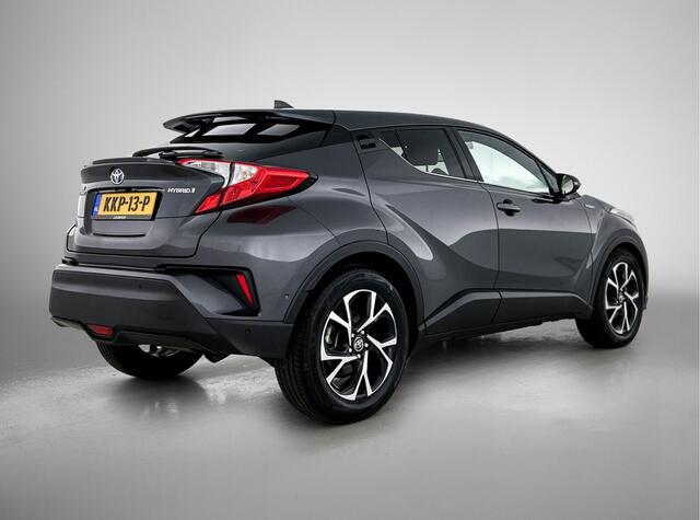 Toyota C-HR 1.8 Hybrid Style | Dodehoek detectie | Lederen bekleding | Stoel+stuurverwarming | Parkeersensoren voor+achter met assistent | Navigatie | Cruise control Adaptive |