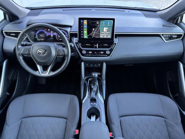 Toyota COROLLA Cross Hybrid 140 Style Automaat / Adaptieve Cruise / Apple carplay & Android auto / Elektrische Achterklep / Stuur-, stoel- en voorruitverwarming / Navigatie / Camera / Keyless / Draadloze telefoonlader /