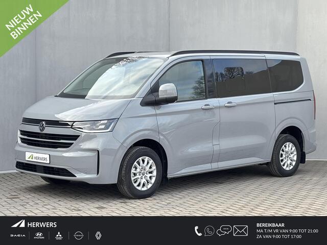 Volkswagen E-Transporter Caravelle 32 L1H1 Life 64 kWh Automaat / NIEUW/ Fabrieksgarantie tot 12-2027 / 8 Persoons / Stone Gray / Warmtepomp / Apple Carplay/Android Auto / Licht en zicht-pakket / Keyless entry / draadloze telefoonlader /