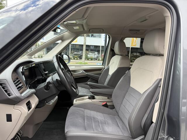 Volkswagen MULTIVAN 1.4 eHybrid Style 7p. LEER-ALCANTARA/TREKHAAK/IQ-LIGHT/EL.SCUIFDEUREN/SFEER/NAVI/CARPLAY/ADAPTIVE CRUISE/CHROOMSTRIP EXTERIEUR/PRIVACY/INDIUMGRAU-METALLIC/BOUWJAAR 04-2023/BTW-AUTO, PRIJS IS INCL. BTW