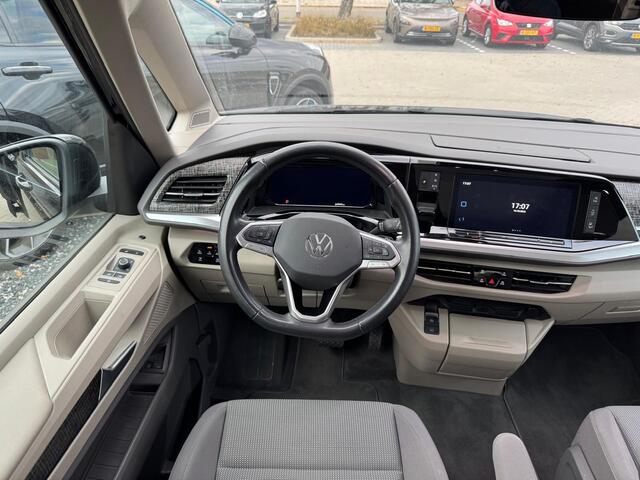 Volkswagen MULTIVAN 1.4 eHybrid 218 Pk Automaat 6-Persoons | Elektrische schuifdeur | Trekhaak | Panoramadak | LED | Adaptive Cruise | Camera | Carplay | 18 Inch | 64.949 Km!!