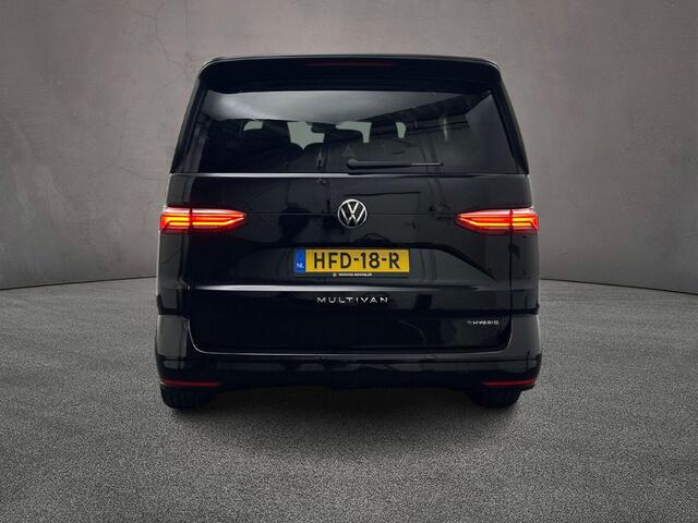 Volkswagen MULTIVAN 1.4 TSI 218pk DSG eHybrid PHEV L2 Life | Lederen bekleding | 7-zits vis-a-vis incl. tafel | Elek. schuifdeuren en achterklep | Trekhaak | ACC | Navigatie |Camera | Keyless | Alarm