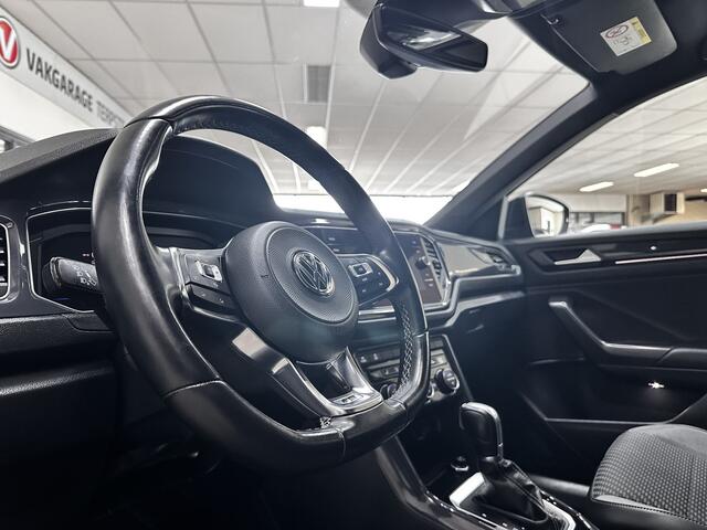 Volkswagen T-Roc 1.5 TSI Sport Business R/ Automaat!/ Trekhaak/ Zwarte hemel/ Virtual Cockpit/ LED Koplampen/ 18''LMV/ Stoelverw./ Grootlichtass./ Flippers/ Apple+Android/ DAB+/ Clima/ Navi/ Cruise/ Bluetooth/ Multi.Stuur/ PDC V+A.