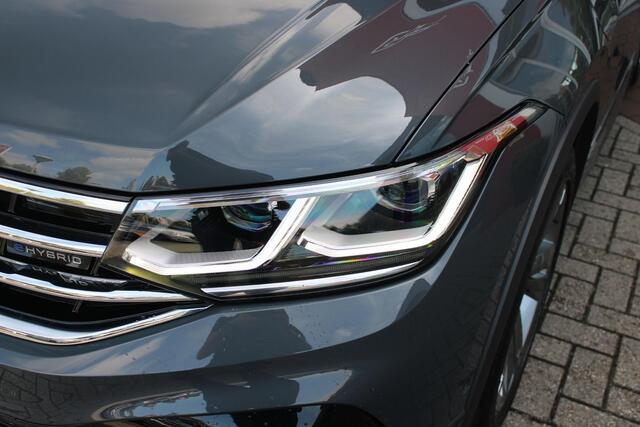 Volkswagen TIGUAN 1.4 TSI 245PK eHybrid R-LINE BUSINESS + | BEKLEDING LEDER VIENNA | PANORAMISCH SCHUIF/KANTEL DAK | ELEKTRISCH WEGKLAPENBARE TREKHAAK | R-LINE INTERIEUR/EXTERIEUR | VERWARMBARE VOORSTOELEN/STUUR | ELEKTRISCH BEDIENBARE VOORSTOELEN MET GEHEUGEN FUNCTIE | AK