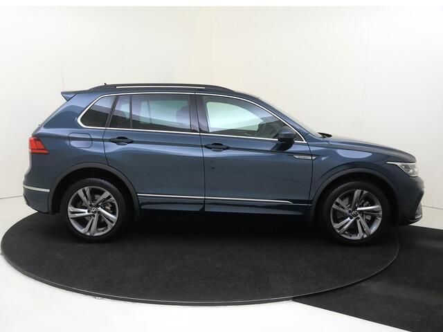 Volkswagen TIGUAN 1.4 TSI eHybrid R-Line Business | SoH 90% | Trekhaak | Achteruitrijcamera | Parkeerassistent | 3-zone airco | Dodehoek detectie | Keyless | Adaptieve cruise control | CarPlay |