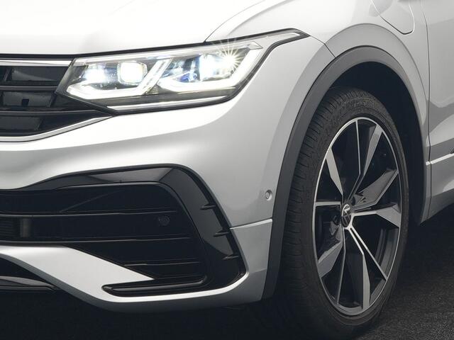 Volkswagen TIGUAN 1.4 TSI eHybrid R-Line PHEV 245pk Dealer O.H | Trekhaak Af Fabriek | Adaptive Cruise | IQ Light | Adaptive Onderstel | Camera | Alcantara Sportstoelen & Stuur Verwarmd | Blis | Keyless | Sfeerverlichting | Virtual | Navigatie | DAB | 20"L.M | Plug In Hybr