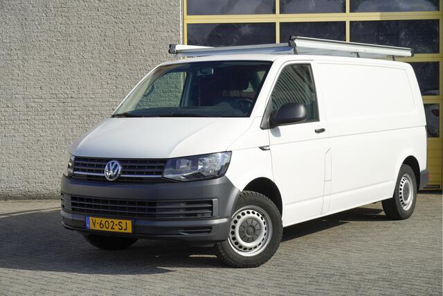 Volkswagen TRANSPORTER 2.0 TDI L2H1 Comfortline BJ2018 Pdc | Navi | Trekhaak | App-Connect | Airco | Cruise control | Getint glas | Imperiaal | Tussenschot+Raam | Achterklep+Raam | Zijdeur